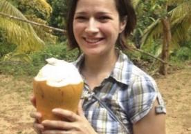 Laura Luttrell, SLPFC Postgraduate Fellow, with a coconut